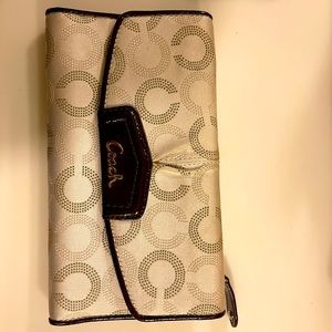 Coach checkbook size wallet. Beige with dark brown leather trim.